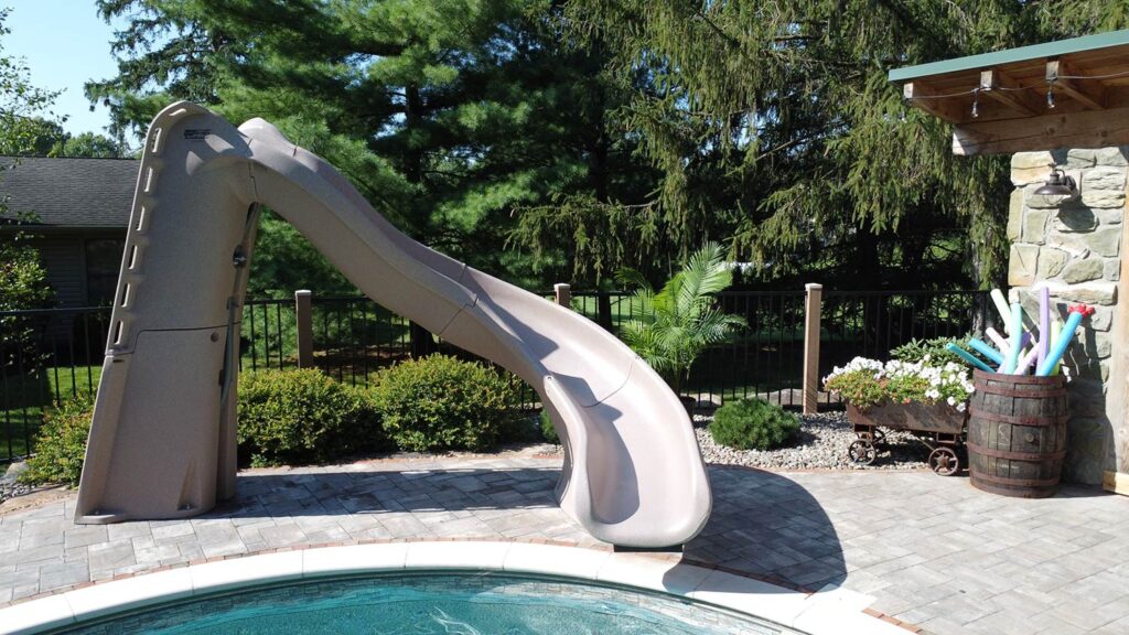 A water slide and pool toys.