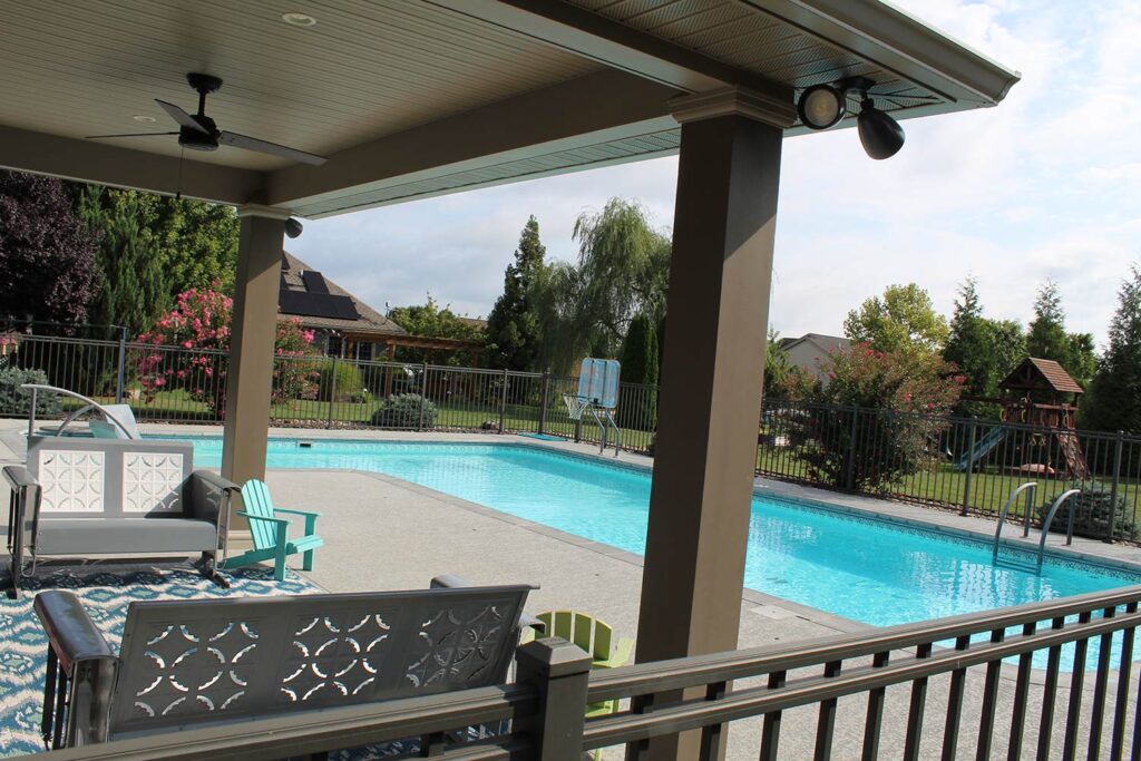 A swimming pool viewed from a lounge area.